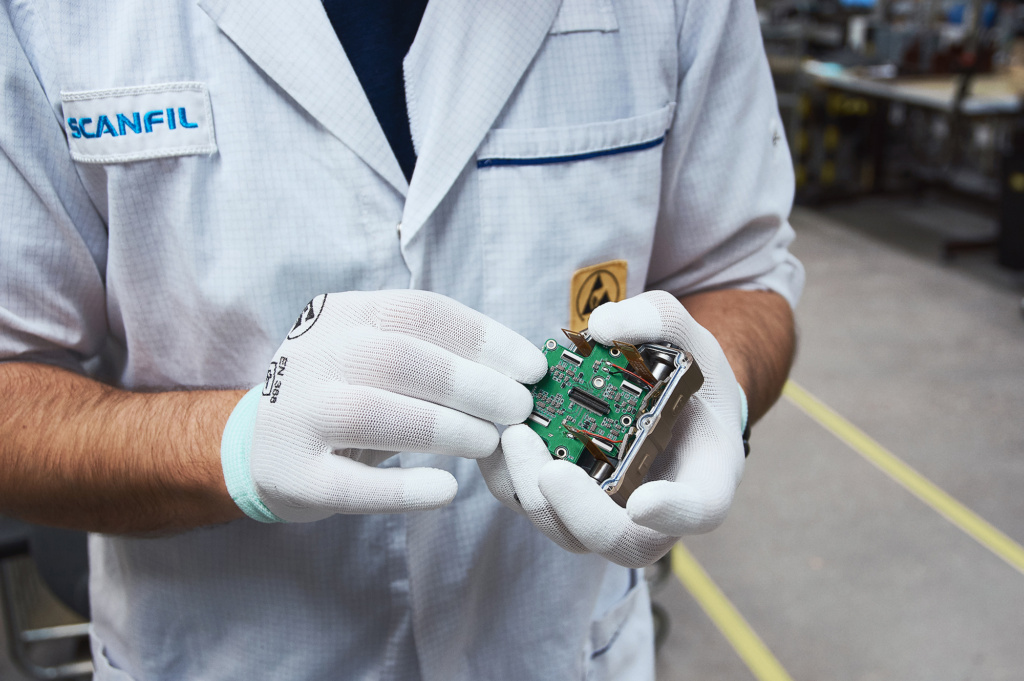 PCBA board presented by Scanfil employee