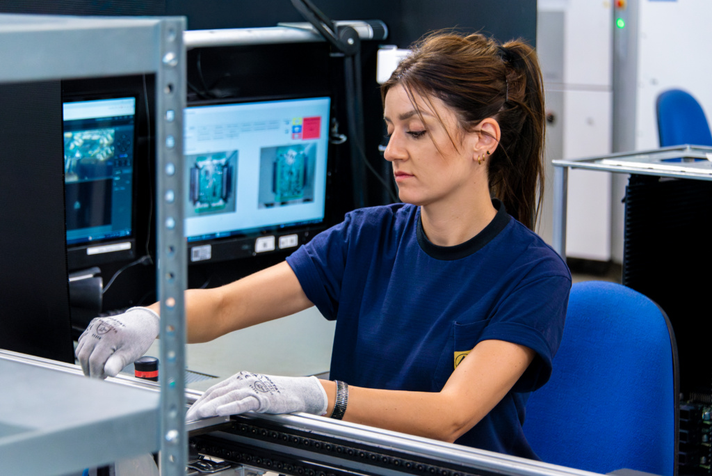 Woman working in Scanfil factory